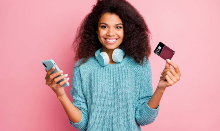 Young Women Holding MC Federal Visa® Debit Card